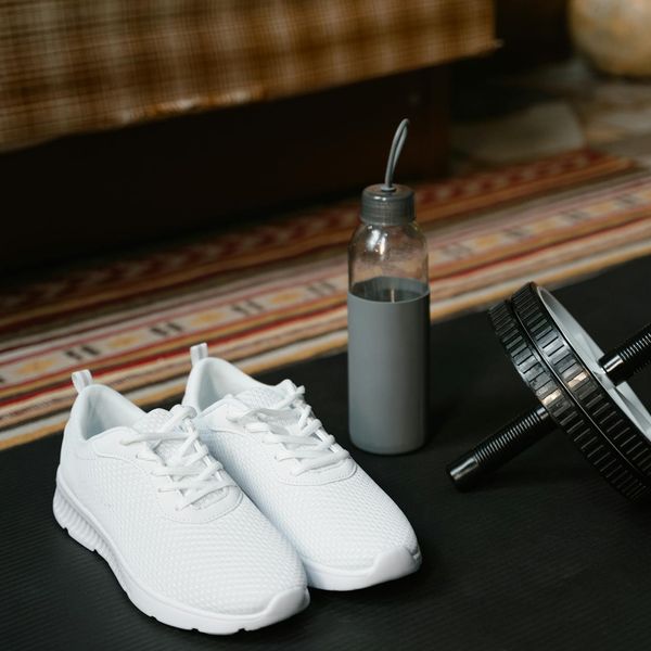 Workout mat and water bottle in a clean workout space